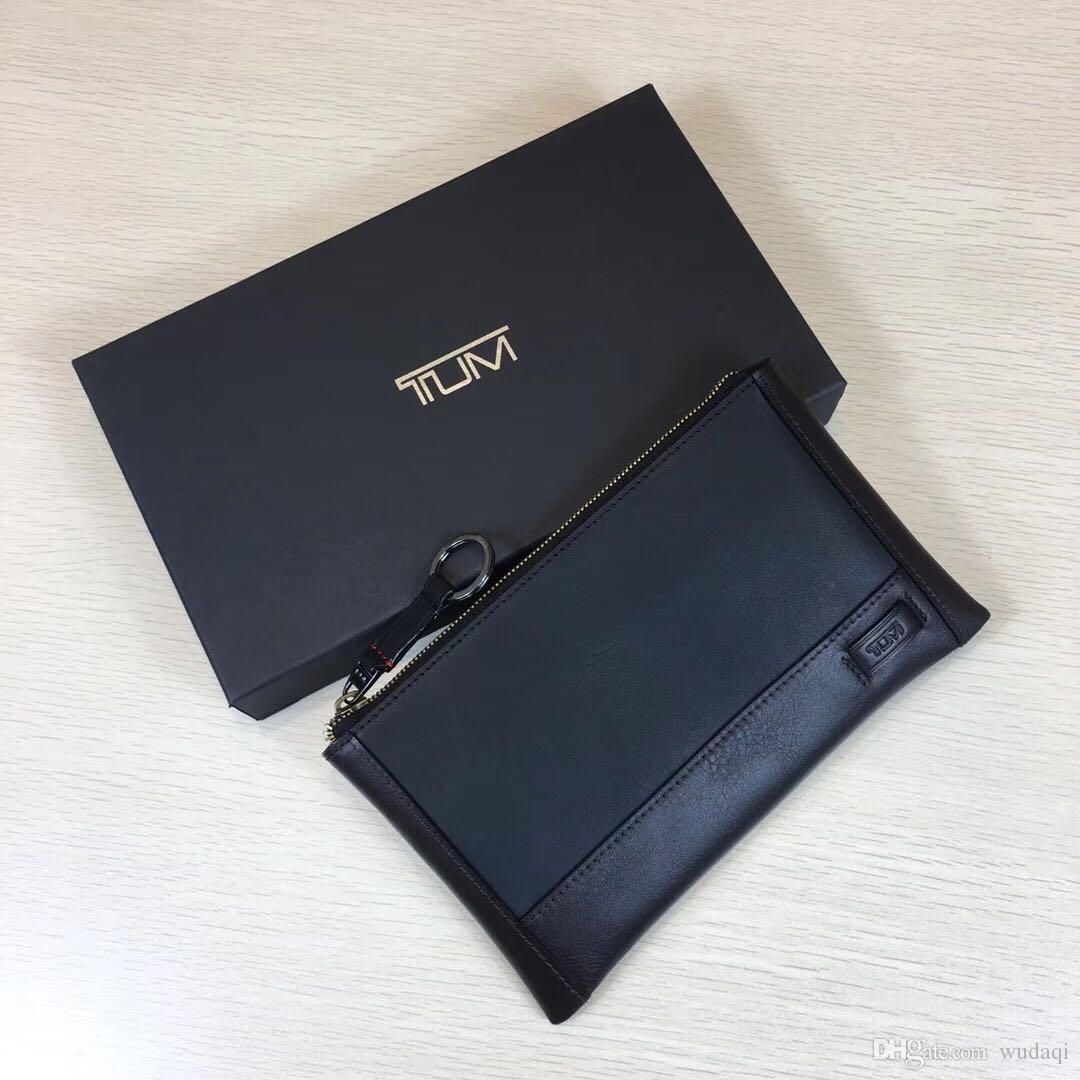 tumi business clutch