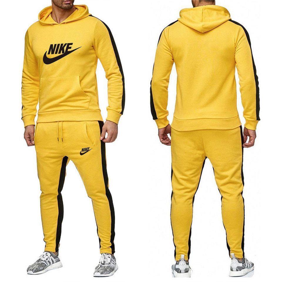 yellow and black nike jogging suit 