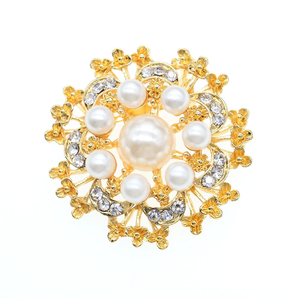 gold round brooch