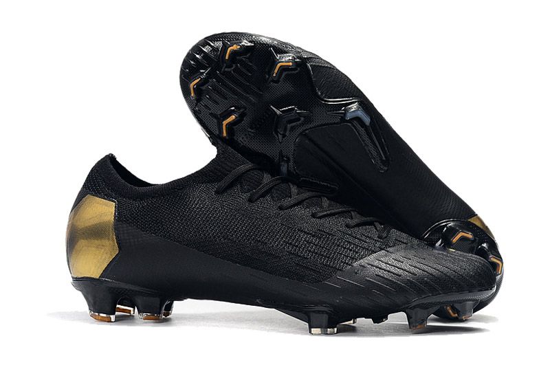 gold and black football boots