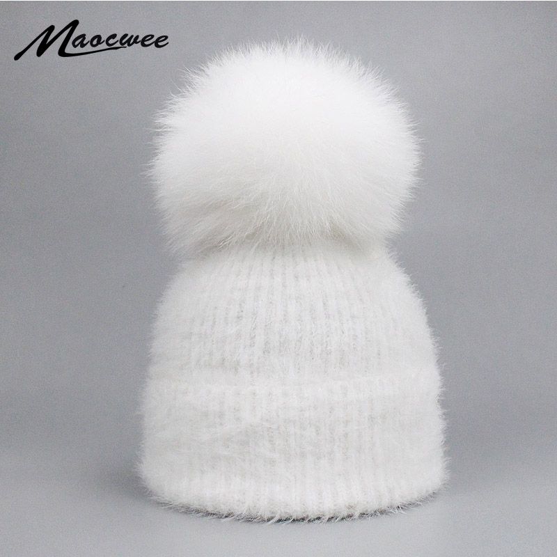 red winter hat with pom pom