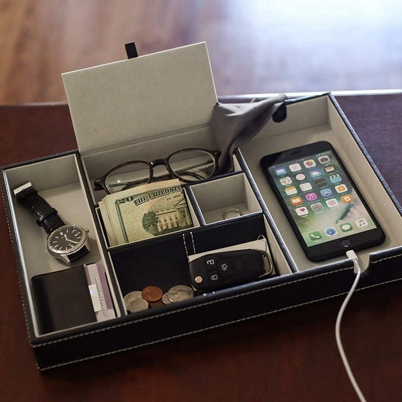 A nightstand organizer that accommodates your phone, keys, wallet watch and possible other stuff that you can cram in there. hlzs valet tray for men edc tray
