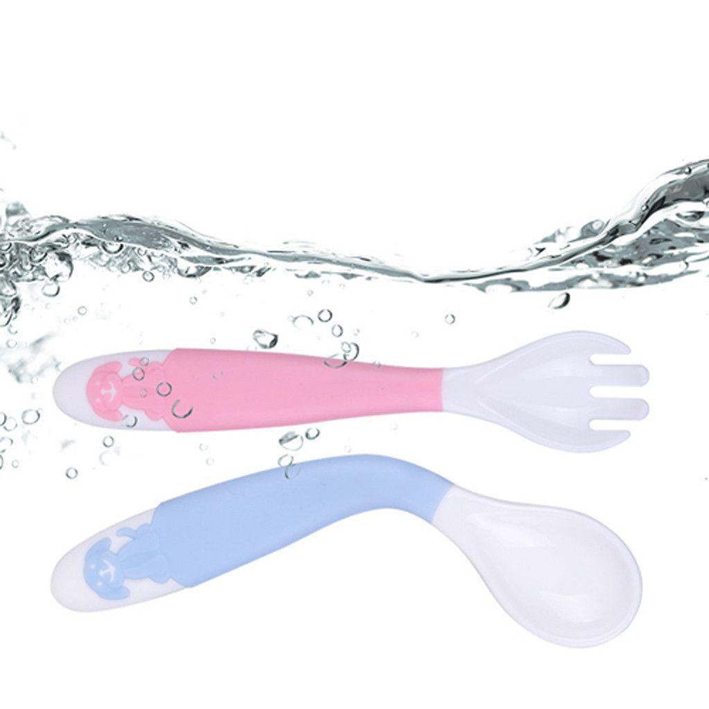 baby learning spoon
