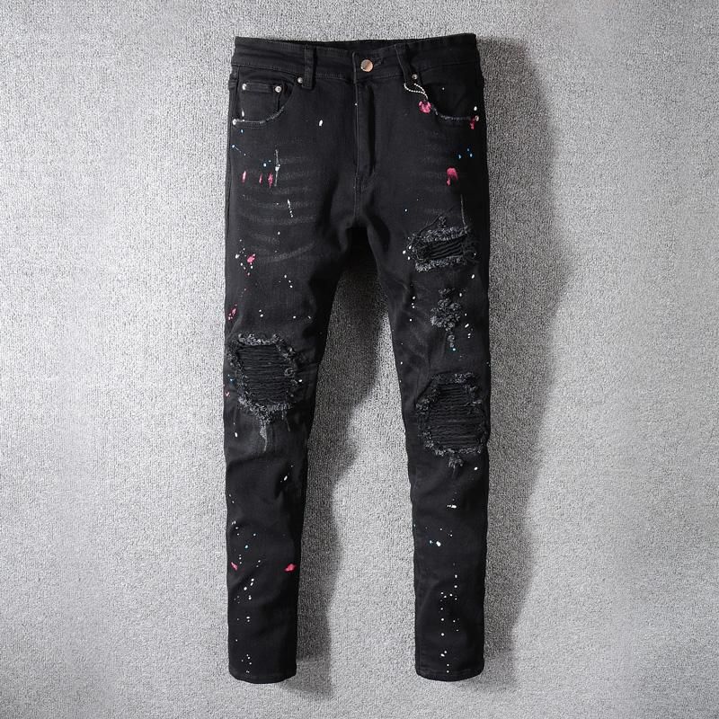 black ripped jeans paint