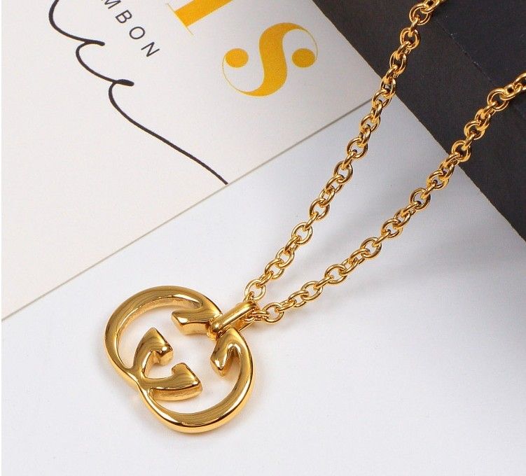 gucci logo pendant