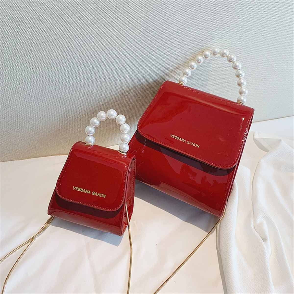 small red bolsa with handle