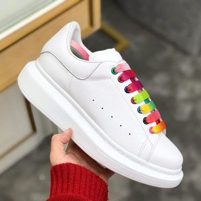 white sneakers with rainbow bottoms