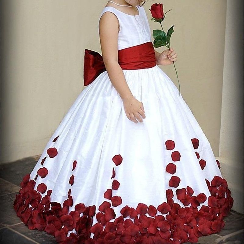 white flower girl dress with red sash