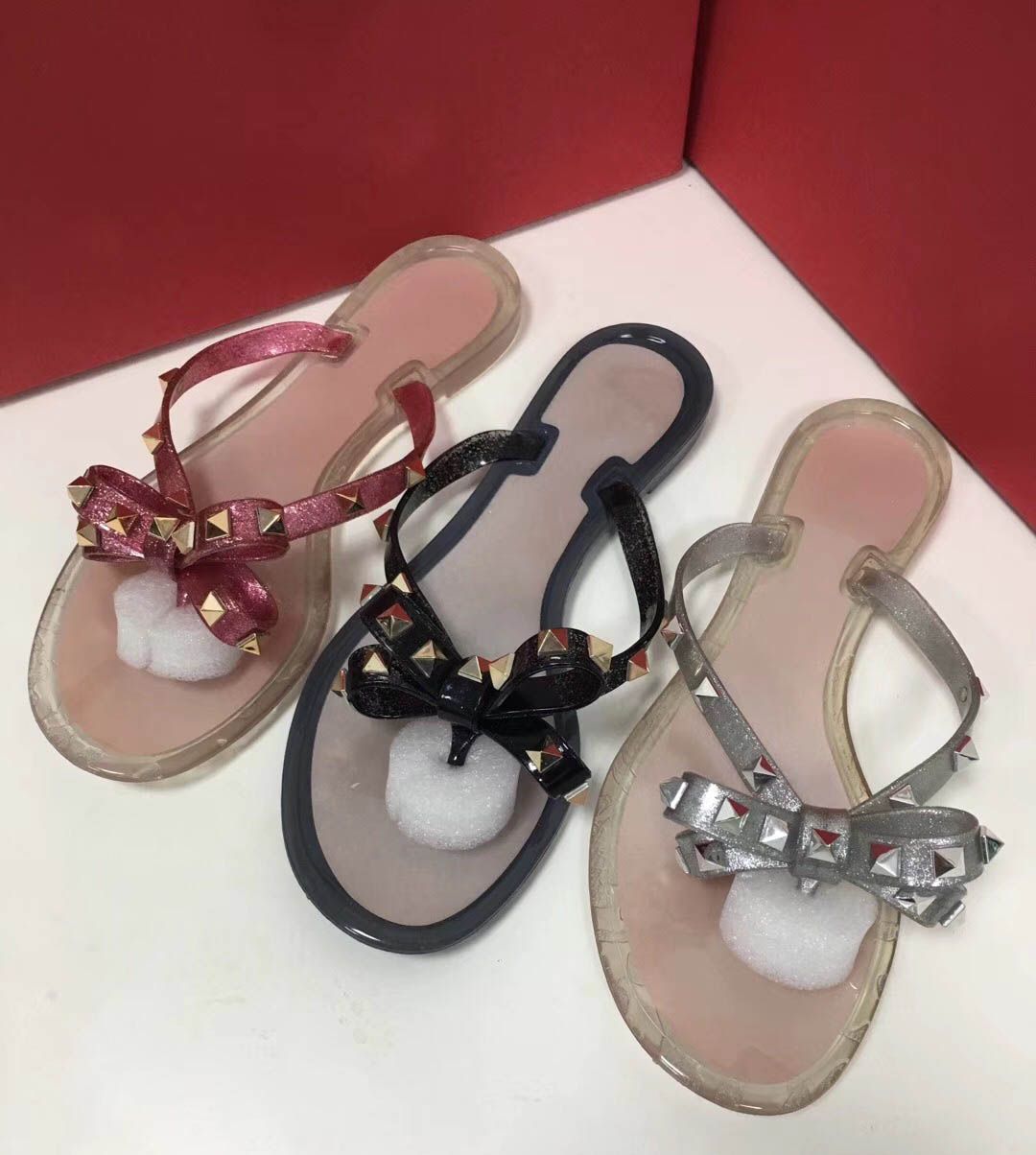 studded flip flops with bow