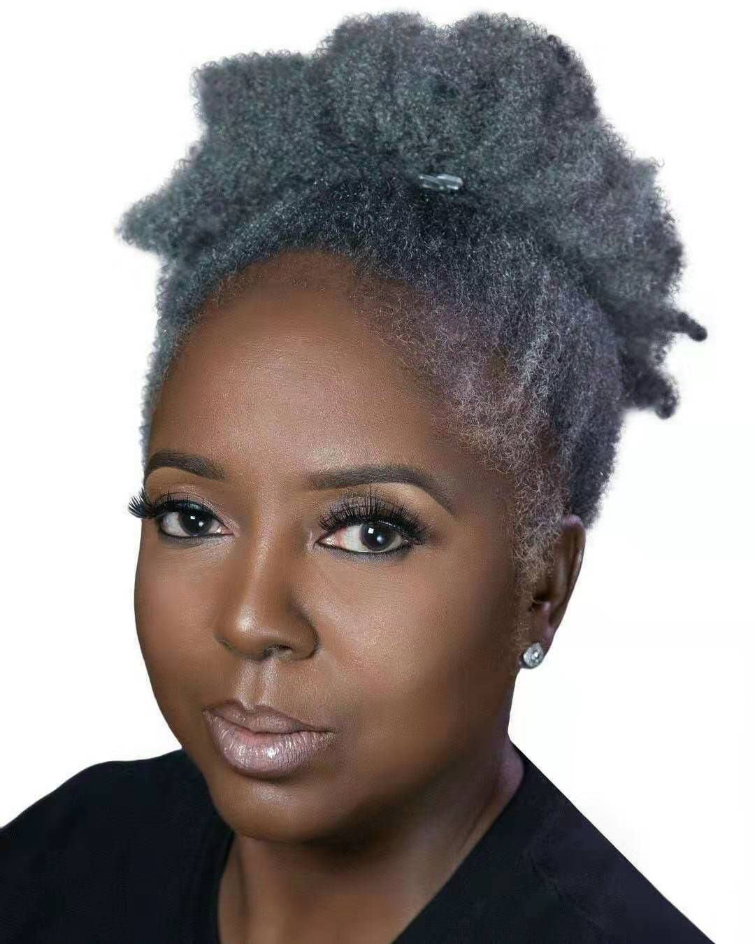 Image of Shaggy grey hair with a ponytail