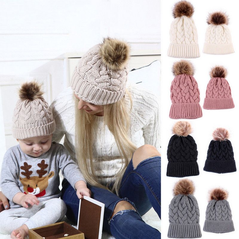 mother and baby matching bobble hats