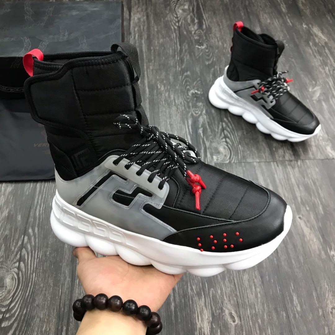 versace black chain reaction sneaker boots
