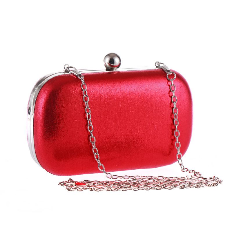 red and gold clutch bag