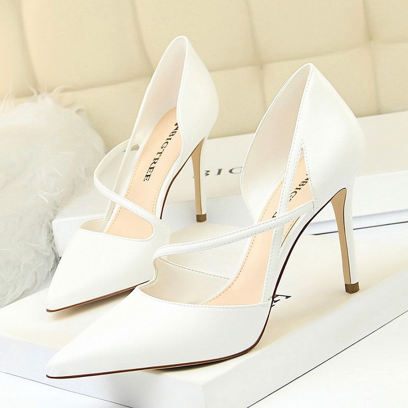 pointed white heels