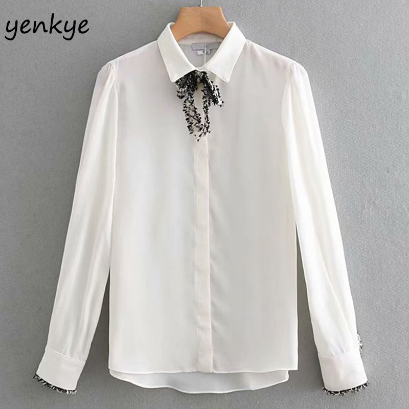 white flowy long sleeve shirt