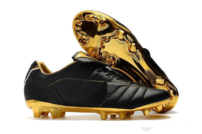 black and gold soccer boots
