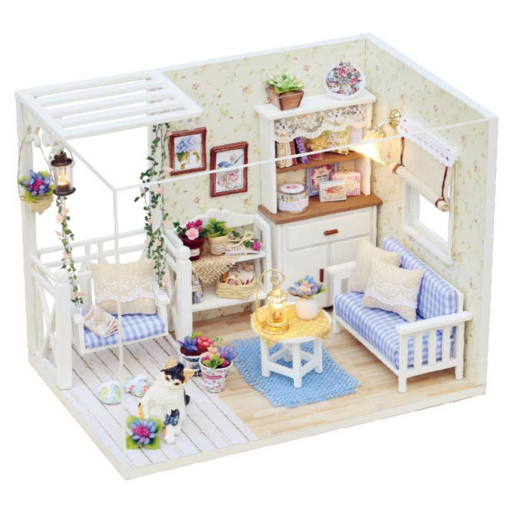 white wooden dolls house