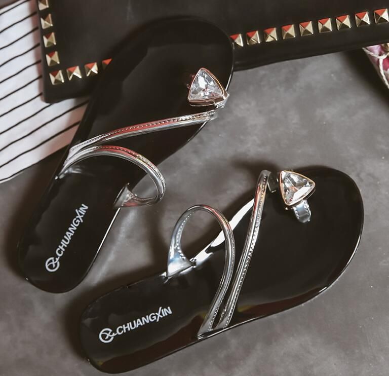 gold and silver flip flops