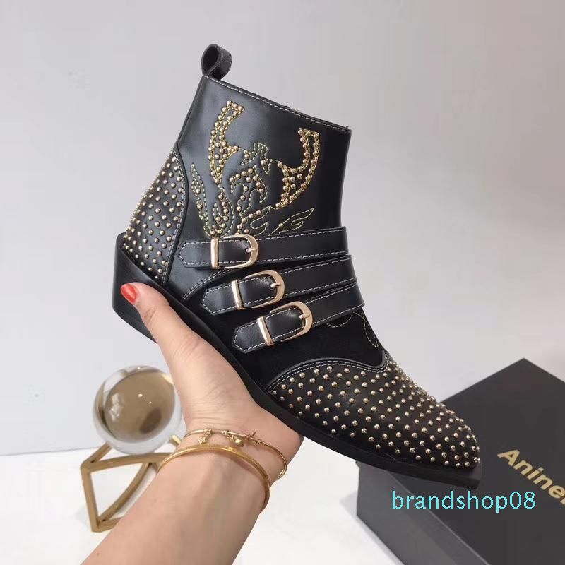 black boots gold studs