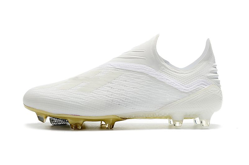 gold laceless football boots