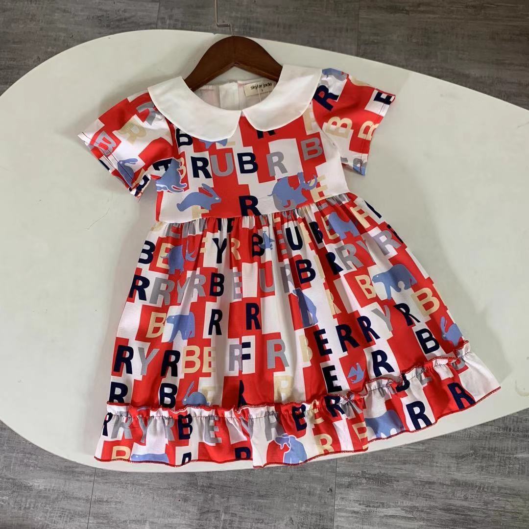 Compre Vestir 2020 Nuevo Britanicos Ninas Del Verano Del Estilo De Manga Corta Carta De Los Ninos De Dibujos Animados Bebe Vestido De Princesa Collar De La Muneca Blanca Magnifica Impresa A