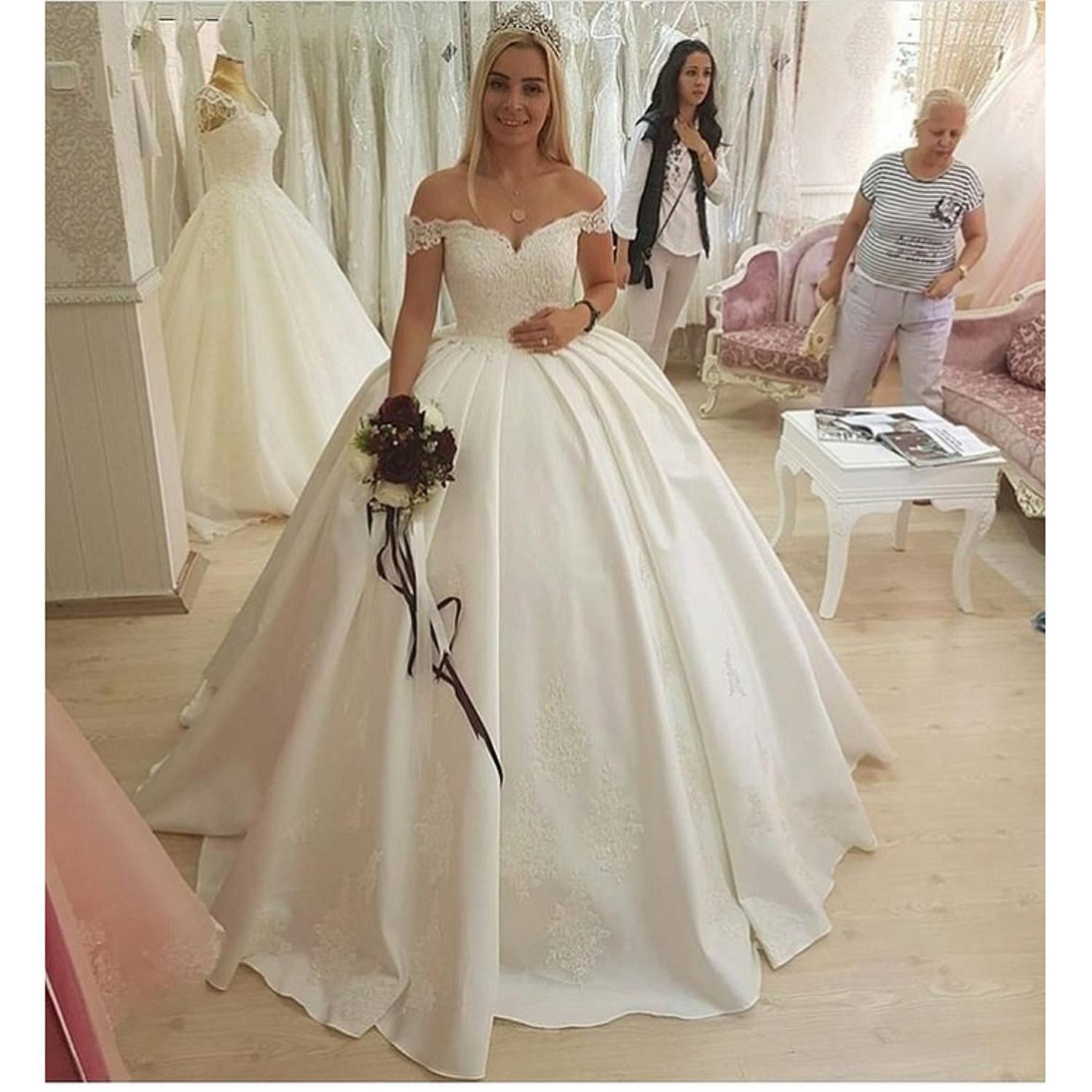 white off the shoulder wedding dress