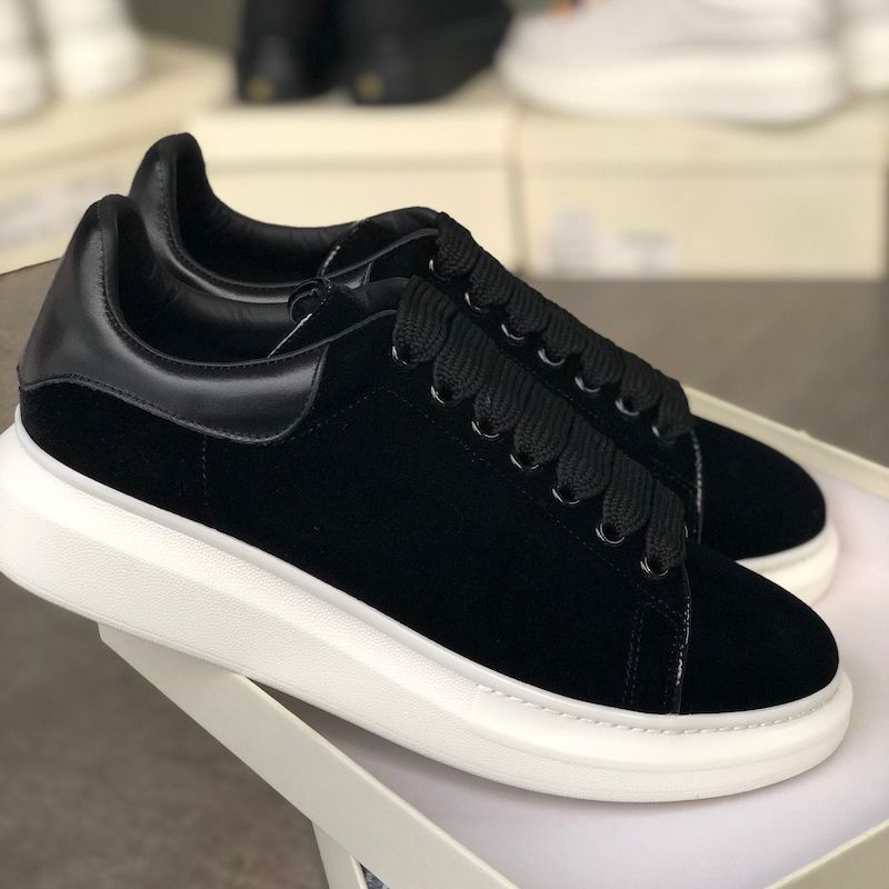 black and gold designer trainers