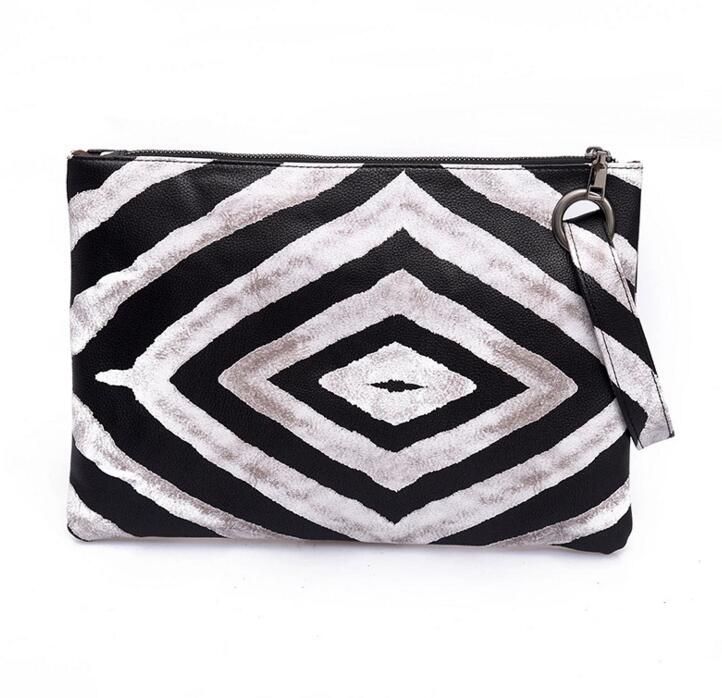 black and white zebra print clutch bag
