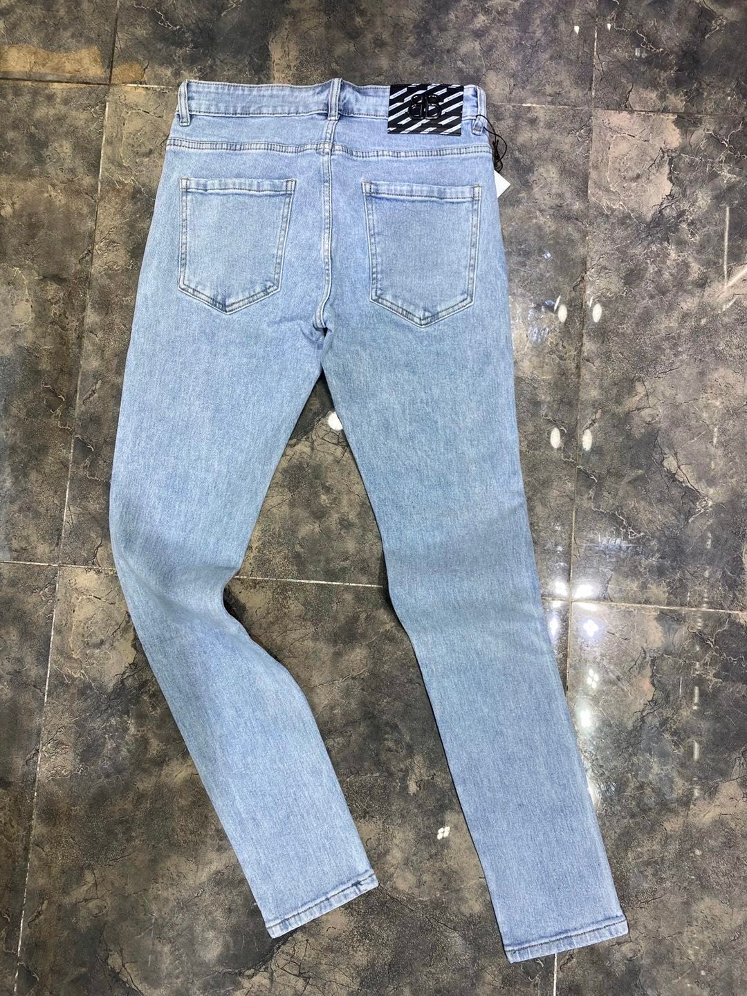 black designer ripped jeans