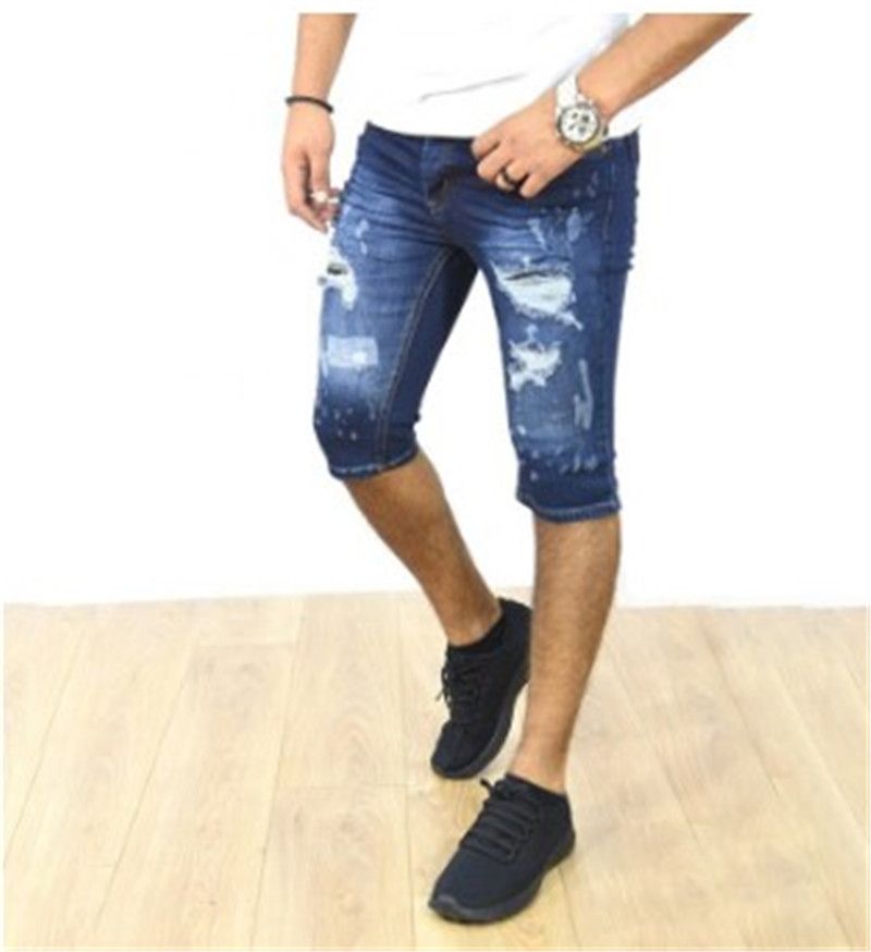 Compra Mediados De Cintura Recta Mosca De La Cremallera Pantalones Cortos  Hombre Del Diseñador Agujeros Skinny Jeans Con Bolsillos Longitud De La  Rodilla De La Calle Los Pantalones Cortos Barato | Entrega