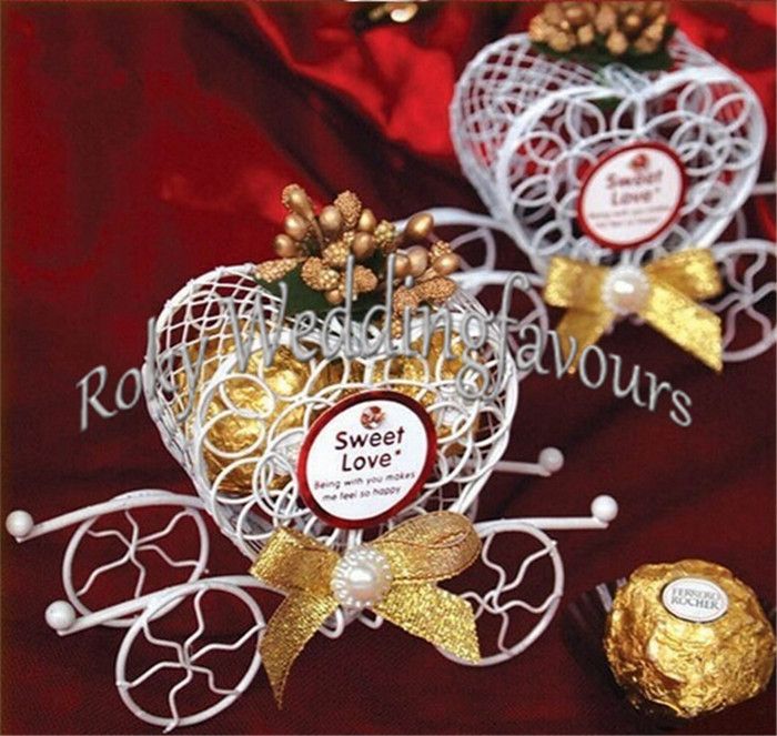 You can seek weddingfavours for help. All the free shipping 50pcs iron heart carriage candy boxes with different color flowers wedding favors bridal shower part