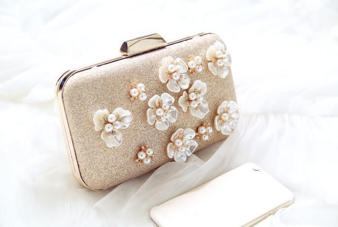 gold and pearl clutch bag