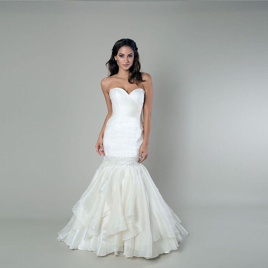 Exaggerated Mermaid Wedding Gown Features A Ruched Wrapped Bodice ... Exaggerated Mermaid Wedding Gown Features A Ruched Wrapped Bodice ...