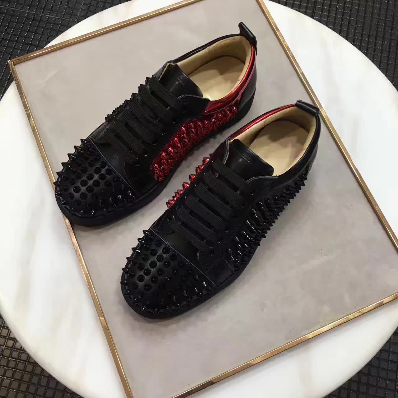 red bottom flats with spikes