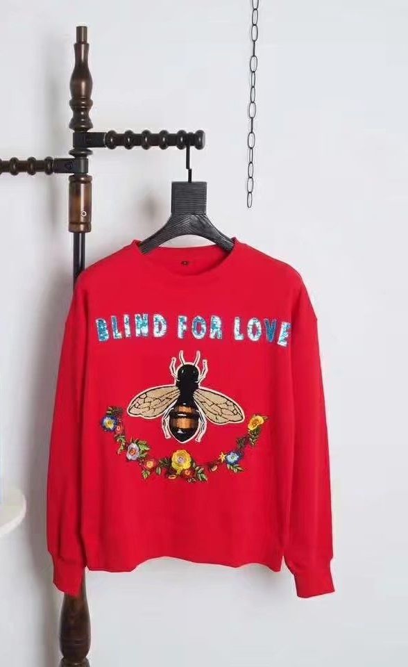 sweater with bee logo