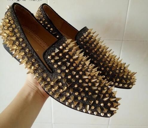 black dress shoes with gold spikes