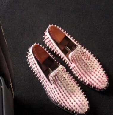 white loafers with gold spikes