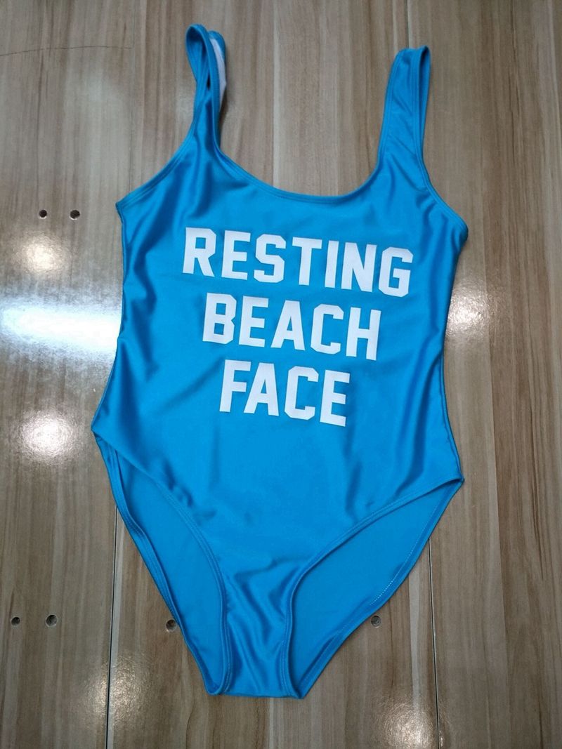 resting beach face swimsuit