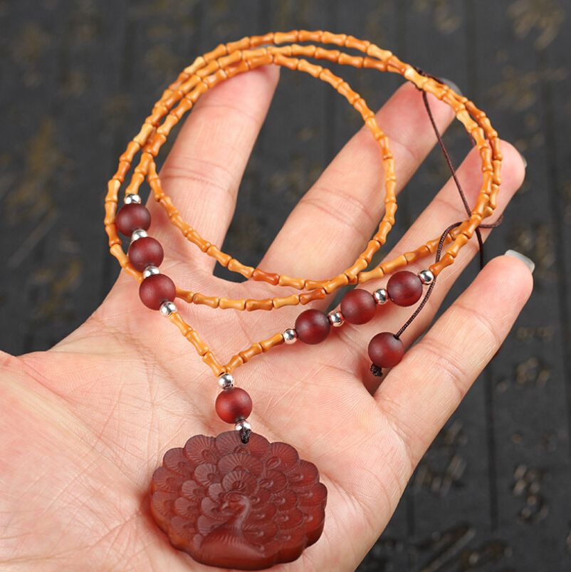 Exquis Noyau D Olive Sculpture Slub étape Par étape Rose Perles Bracelet Bouddhiste Avec Vieux Mouton Corne Sculpture Peacock écran Pendentif - 