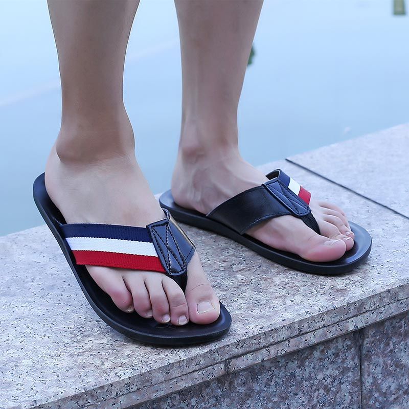 men's feet in flip flops