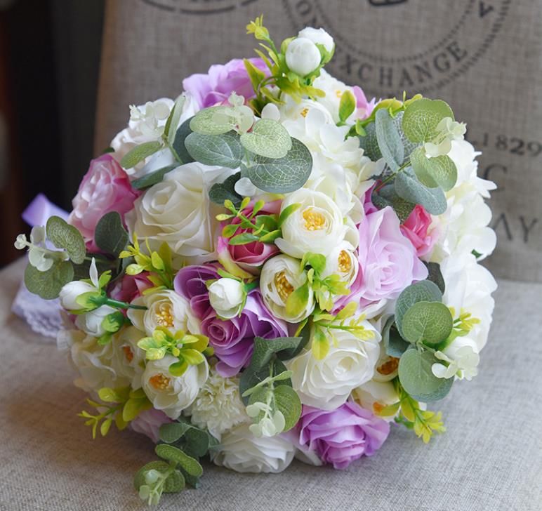 the bride holds bouquet