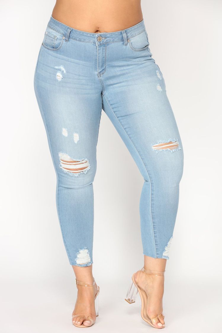 knee cut blue jeans