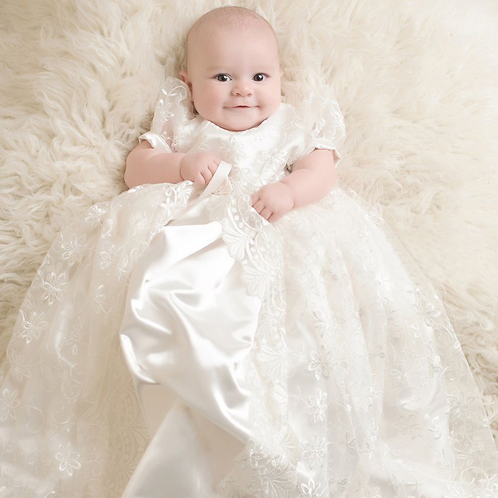 baby in christening gown