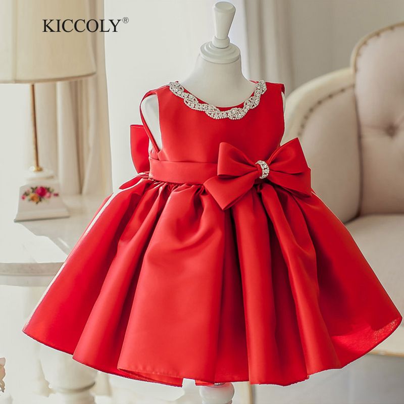baby girl in red dress