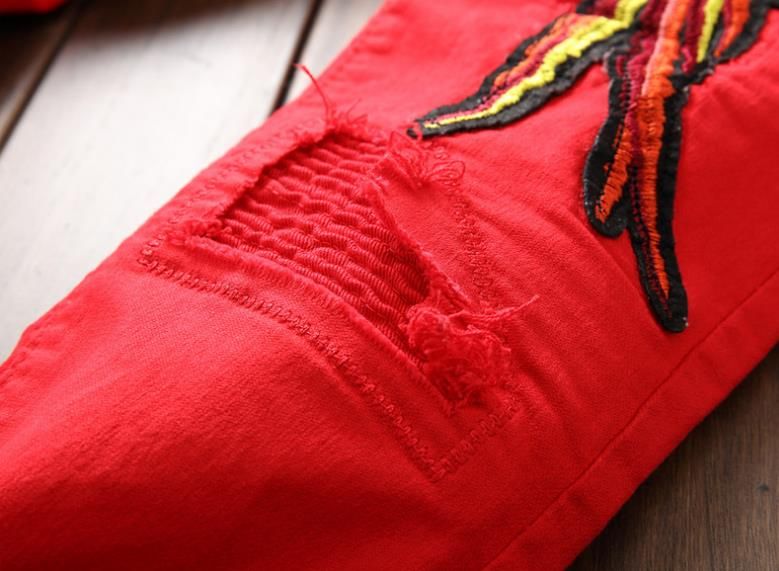 red ripped pants