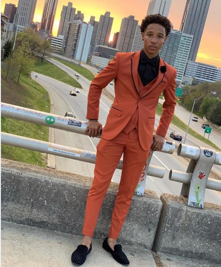 orange and silver prom suit