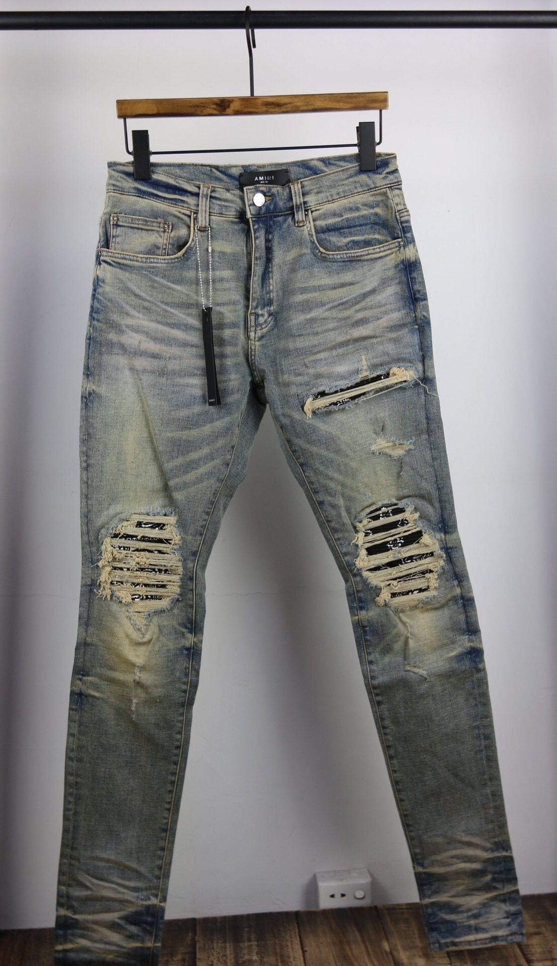 ripped jeans with bandana patches