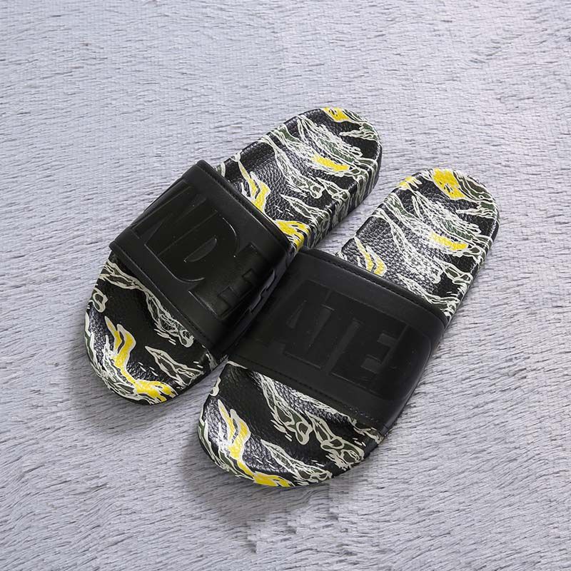 black designer flip flops