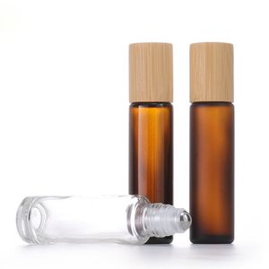 Rouleau de verre vide cosmétique de 1/2 OZ sur des bouteilles d'emballage de parfum givré transparent ambre avec boule en métal et couvercle en bambou