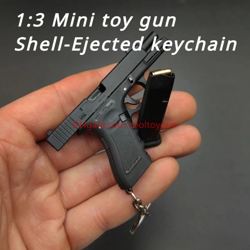 1: 3 G17 Métalage Modèle de pistolet Modèle Alloy Mini Keychain Shell Ejection Pistol Fidgets Toy Look Real impressionnant Collection Cadeaux pour garçons Adulte Portable Luxury Birthday Gift